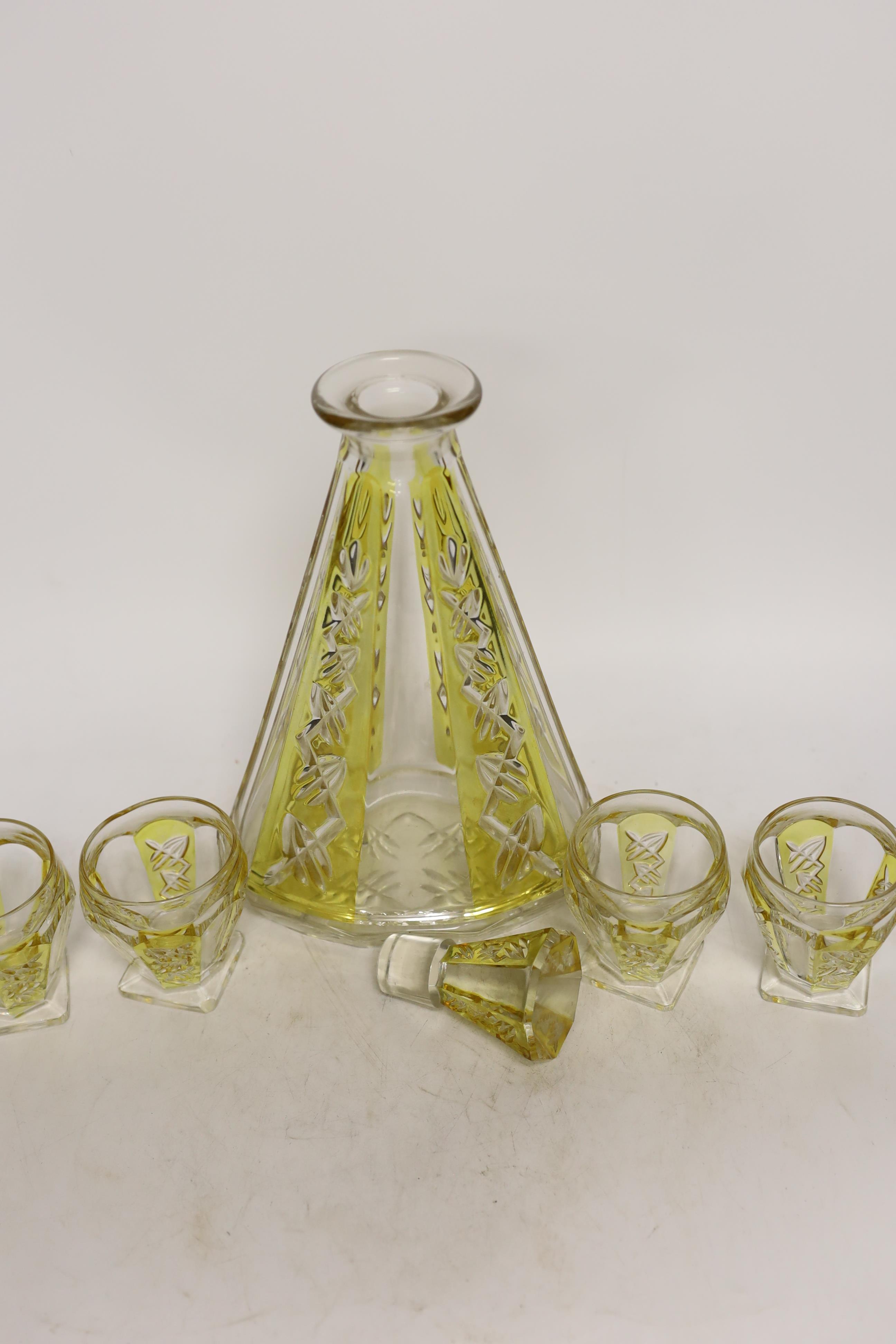 An Art Deco cut glass decanter with four glasses, decanter 29cm high